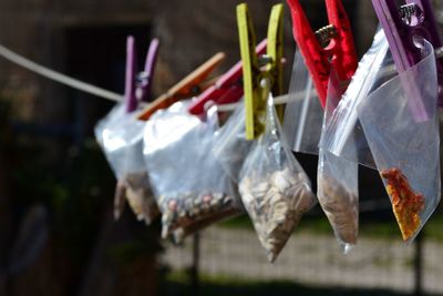 Close-up of clothes hanging on wood