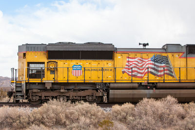 Train on railroad track against sky