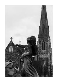 Statue of historic building against sky