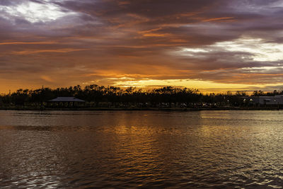 Scenic view of sea against orange sky