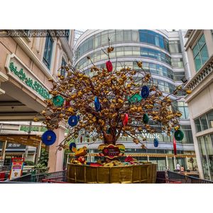 Low angle view of decoration hanging on building in city
