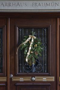 Plants growing by window of building