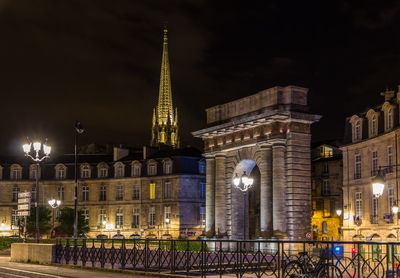 Illuminated buildings in city at night