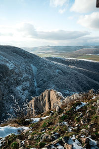 Scenic view of landscape and mountains against sky