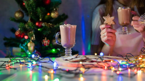 Illuminated christmas decoration on table