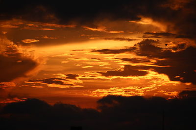 Low angle view of dramatic sky during sunset