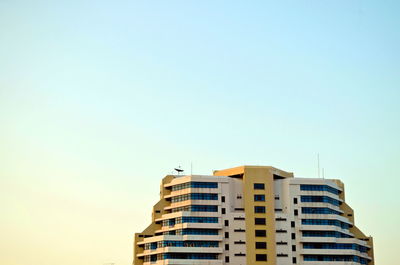 Low angle view of modern building against clear sky