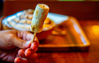 Cropped hand of person holding ice cream