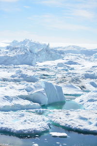 Scenic view of frozen lake against sky