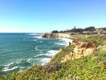 Scenic view of sea against clear blue sky