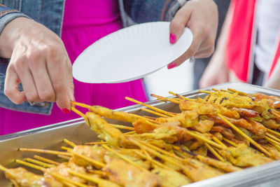 Midsection of man preparing food