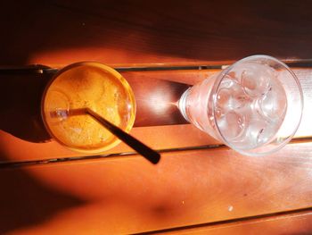 Directly above shot of illuminated light bulb on table