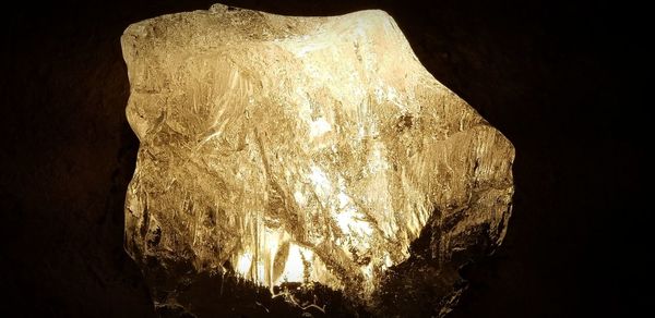 Low angle view of illuminated cave