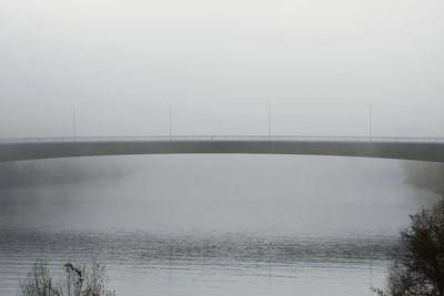 Bridge over sea against sky