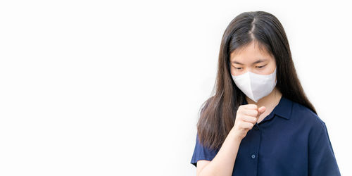 Portrait of a teenage girl over white background