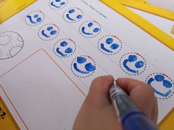 High angle view of child on paper