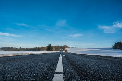 Road in frosty landscape with rime frost, denmark