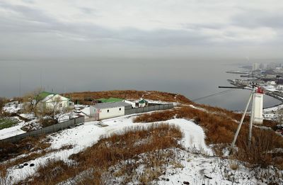 Scenic view of buildings against sky during winter