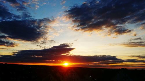 Scenic view of dramatic sky during sunset