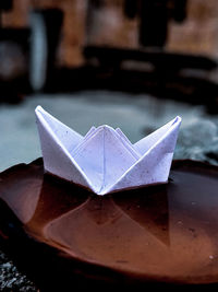 Close-up of paper floating on table
