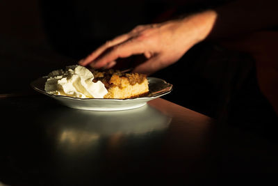 Close-up of hand holding ice cream