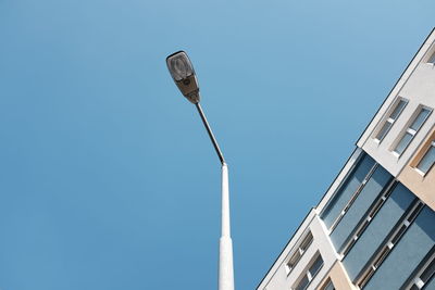 Low angle view of building against clear blue sky