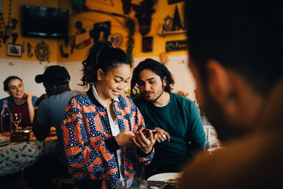 Young couple looking at camera