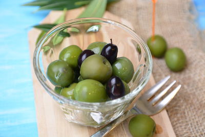 Close-up of fruits in glass bowl on table