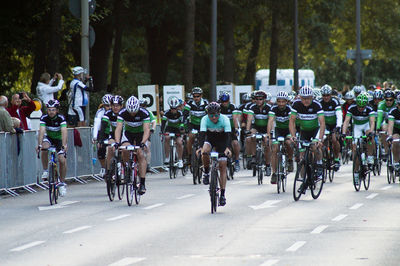Athletes cycling on road during race