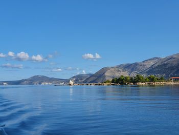Scenic view of sea against blue sky