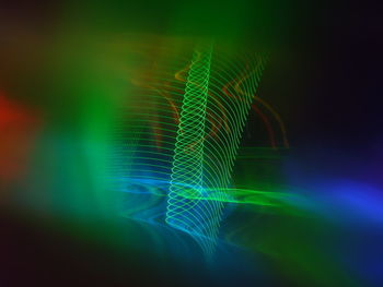 Close-up of light painting against black background