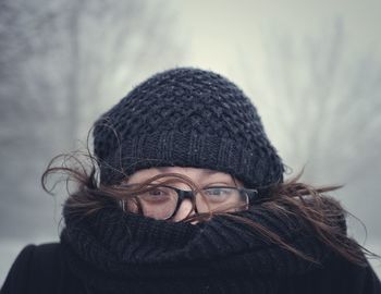 Close-up portrait of woman wearing warm clothing during winter