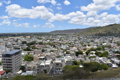 High angle view of buildings in city against sky