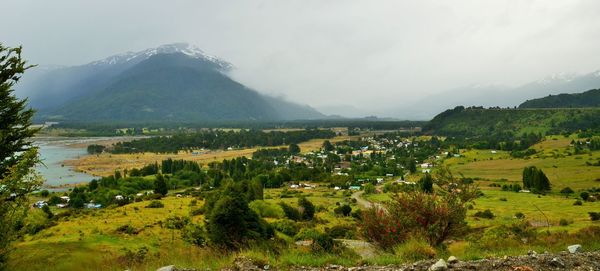 Scenic view of landscape and mountains against sky