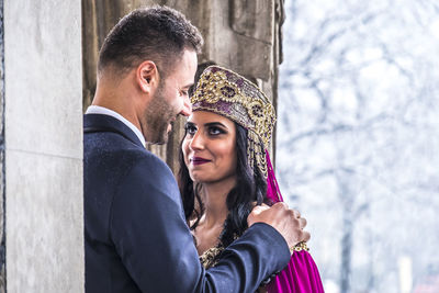 Bride with bridegroom during weeding ceremony