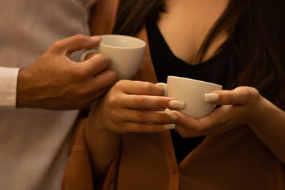 Midsection of woman using mobile phone