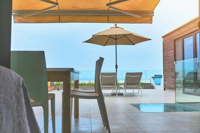 Empty chairs and tables in restaurant