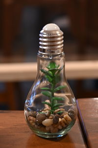 Close-up of juice in glass jar on table