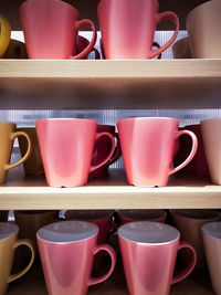 Close-up of coffee cups on table