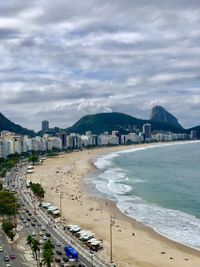 High angle view of beach and buildings against sky