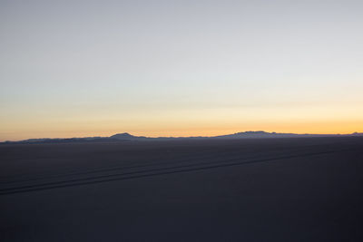 Scenic view of silhouette landscape against sky during sunset