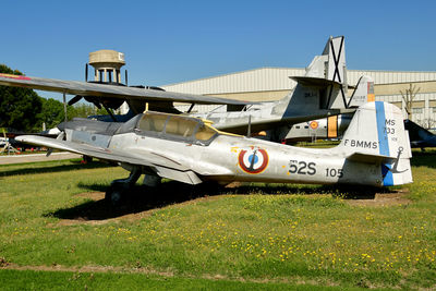 Airplane on field against clear sky