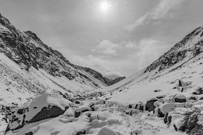 Scenic view of mountains against sky during winter