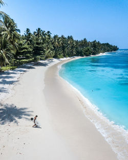 Scenic view of beach against clear sky