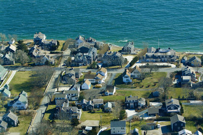 High angle view of townscape by sea