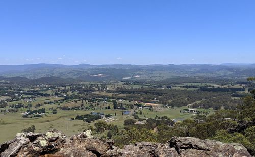 Aerial view of landscape against clear blue sky