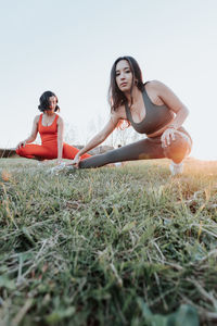 Young woman sitting on grass