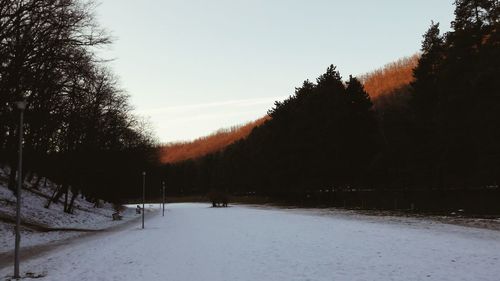 Snow covered landscape against sky