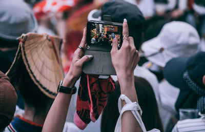 Midsection of woman photographing