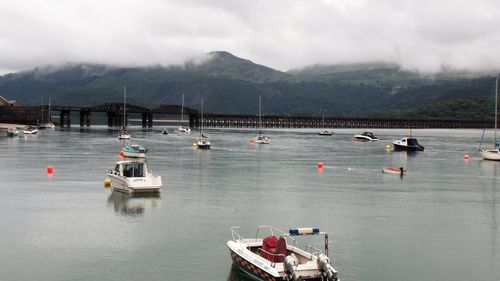 High angle view of boats moored in lake against sky